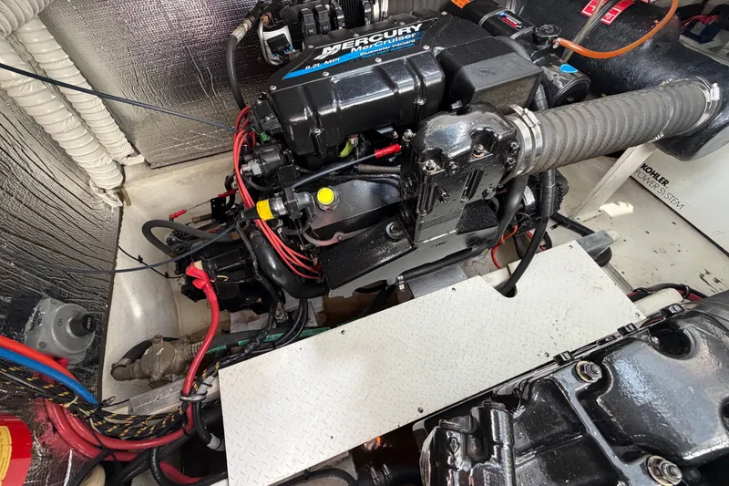 Slide: The Image of Engine compartment of a 2000 Cruisers Yachts 3870 Express with Mercury engine. - 26