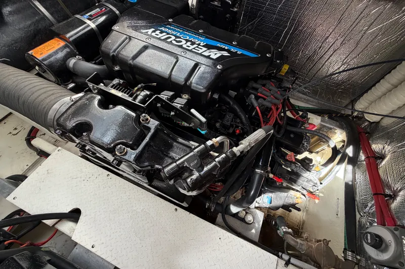 Slide: The Image of Engine compartment of a 2000 Cruisers Yachts 3870 Express with a Mercury engine. - 27