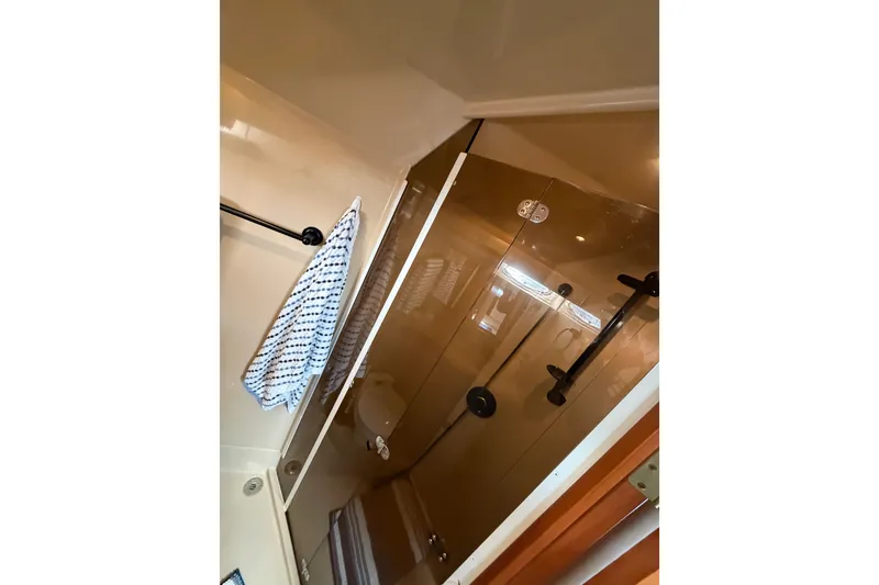 Slide: The Image of Bathroom interior of 2000 Cruisers Yachts 3870 Express with glass shower door. - 20
