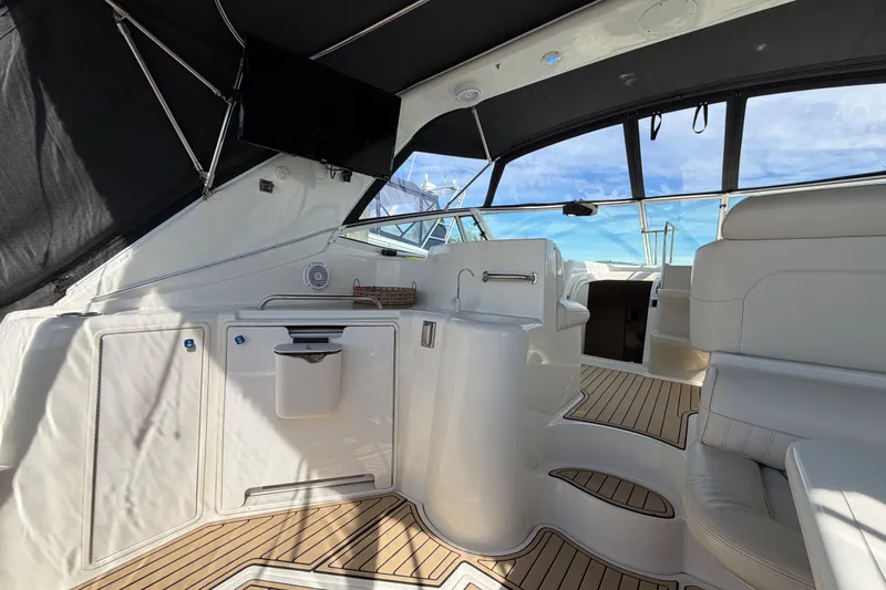 Slide: The Image of Interior of 2000 Cruisers Yachts 3870 Express with sleek seating and modern amenities. - 5