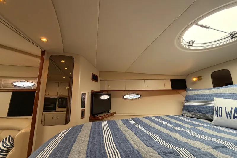 Slide: The Image of Interior of 2000 Cruisers Yachts 3870 Express with cozy bed and modern amenities. - 17