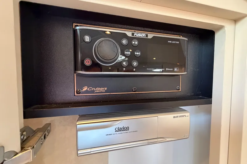 Slide: The Image of Audio system in 2000 Cruisers Yachts 3870 Express, featuring Fusion and Clarion components. - 25