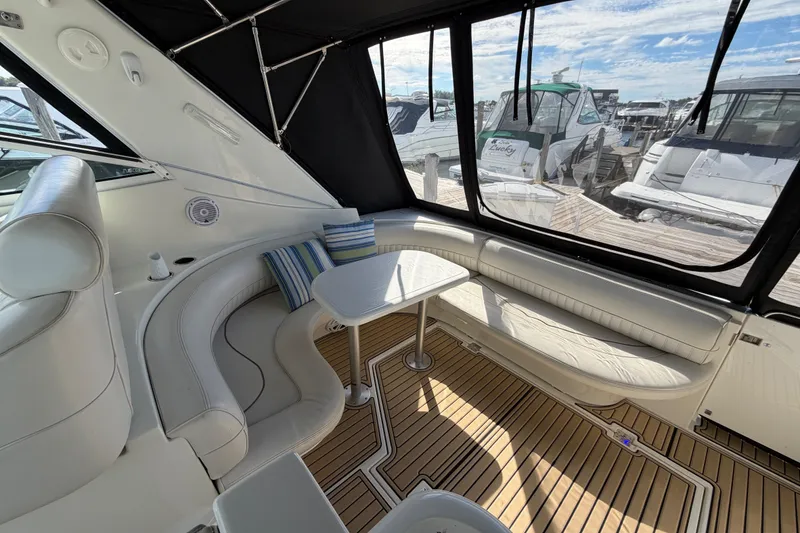 Slide: The Image of Luxurious interior of 2000 Cruisers Yachts 3870 Express with plush seating and elegant table. - 4