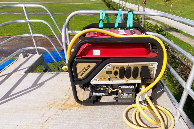 Slide: The Image of Portable generator on a 2019 Solid Craft Commercial Pontoon deck, with yellow cables. - 25