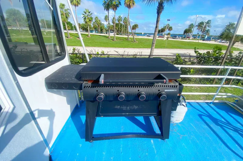 Slide: The Image of Outdoor grill on 2019 Solid Craft Commercial Pontoon, with beach view and palm trees. - 22