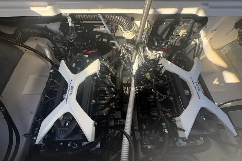 Slide: The Image of 2025 Yamaha AR250 boat engine compartment with dual high-output engines. - 19