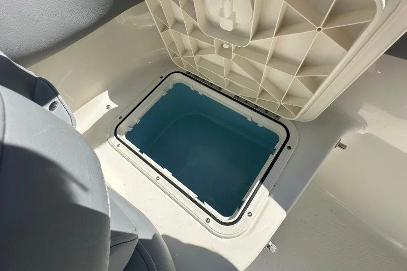 Slide: The Image of Open storage compartment on 2027 Pioneer 202 Islander boat, showcasing interior space. - 14