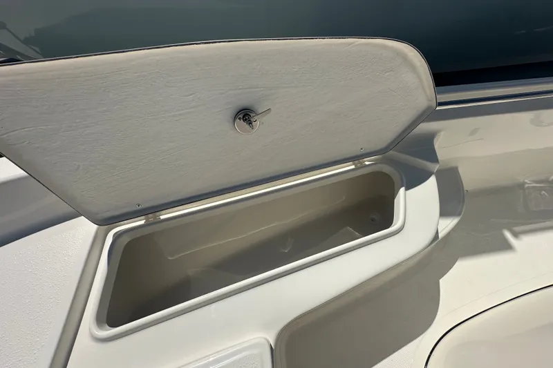 Slide: The Image of Open storage compartment on a 2027 Bulls Bay 2000 XS boat. - 9