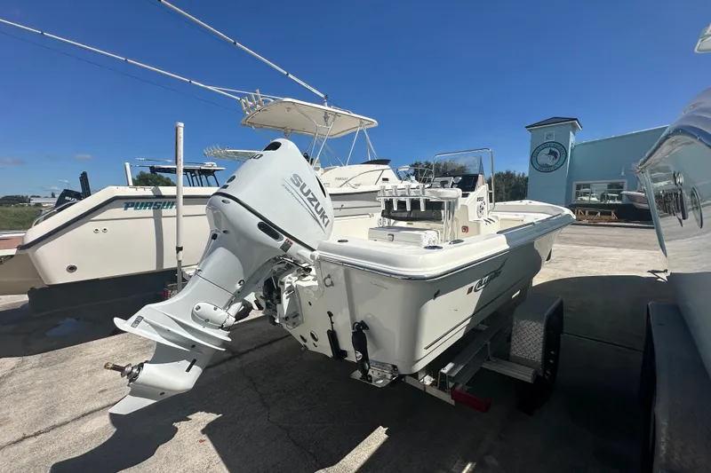 Slide: The Image of 2027 Bulls Bay 2000 XS boat with Suzuki outboard motor on trailer. - 3