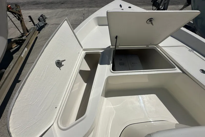 Slide: The Image of Open storage compartments on a 2027 Bulls Bay 2000 XS boat deck. - 8