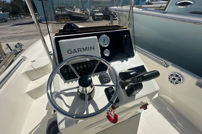 Slide: The Image of Steering console of 2027 Bulls Bay 2000 XS boat with Garmin navigation system. - 6