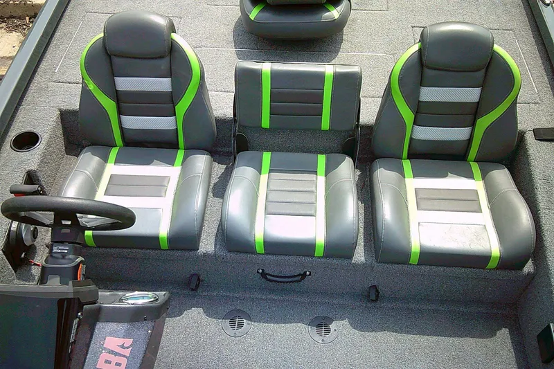 Slide: The Image of 2025 Ranger RT198P boat interior with gray and green seats, steering wheel visible. - 3