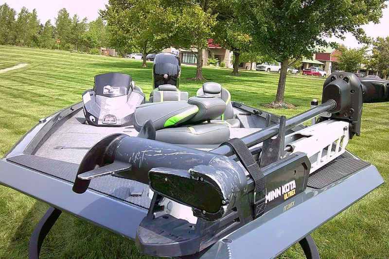 Slide: The Image of 2025 Ranger RT198P fishing boat with Minn Kota Ultrex motor on grassy area. - 8
