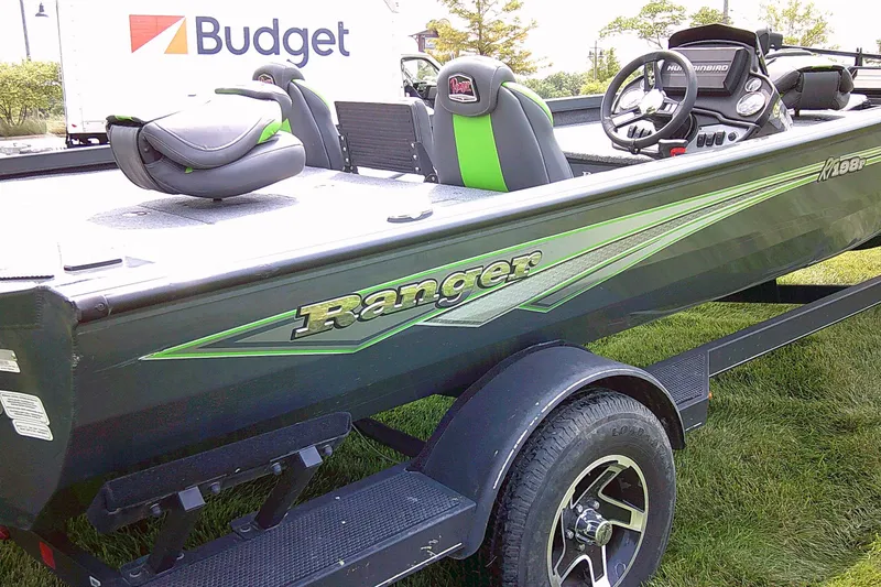 Slide: The Image of 2025 Ranger RT198P fishing boat on trailer, featuring sleek design and modern seating. - 7