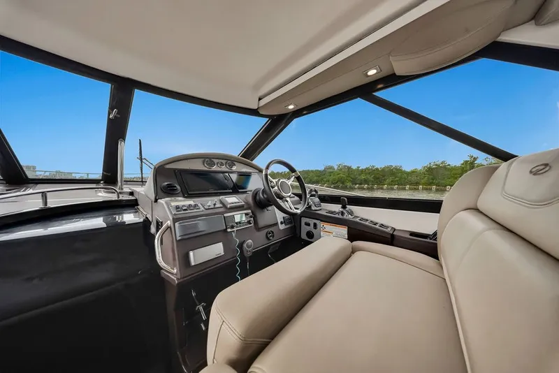 Slide: The Image of Interior of 2014 Regal 42 Sport Coupe yacht with modern helm and seating. - 57