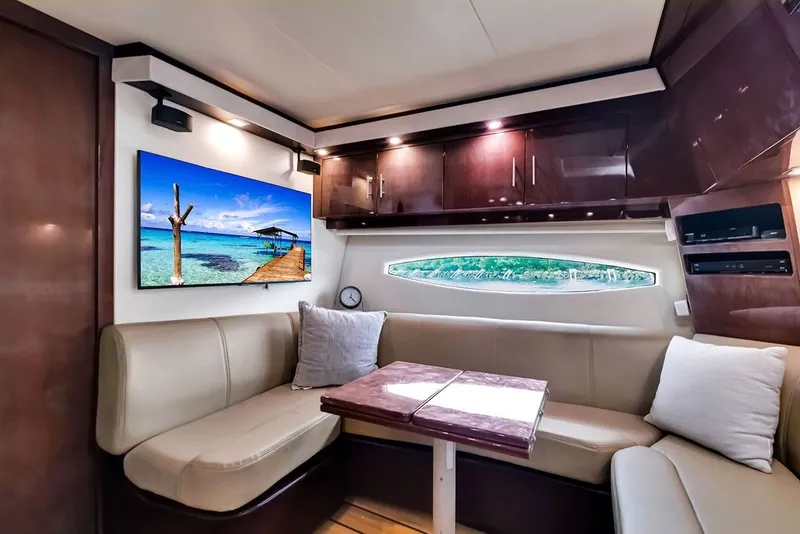 Slide: The Image of Luxurious interior of 2014 Regal 42 Sport Coupe yacht with elegant seating and modern decor. - 38