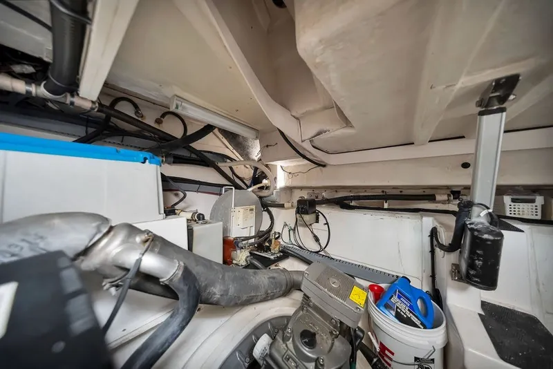 Slide: The Image of Engine room of a 2014 Regal 42 Sport Coupe with visible machinery and equipment. - 62