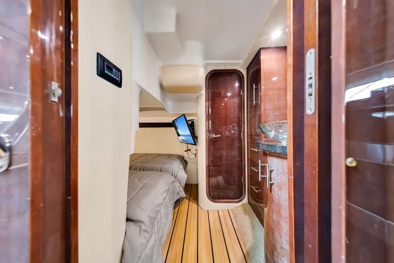 Slide: The Image of Luxurious interior of 2014 Regal 42 Sport Coupe with wood finishes and modern amenities. - 15
