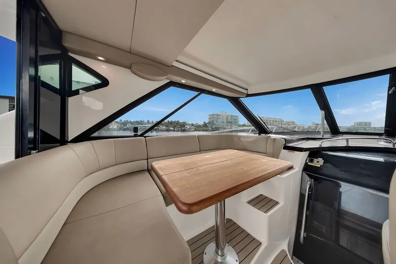 Slide: The Image of Luxurious interior of 2014 Regal 42 Sport Coupe yacht with panoramic windows. - 56