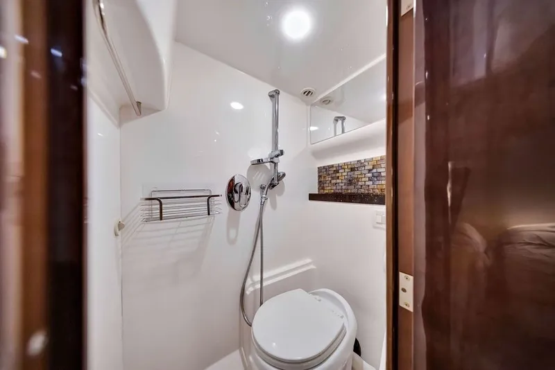 Slide: The Image of Luxurious bathroom in 2014 Regal 42 Sport Coupe yacht, featuring modern fixtures and elegant design. - 22