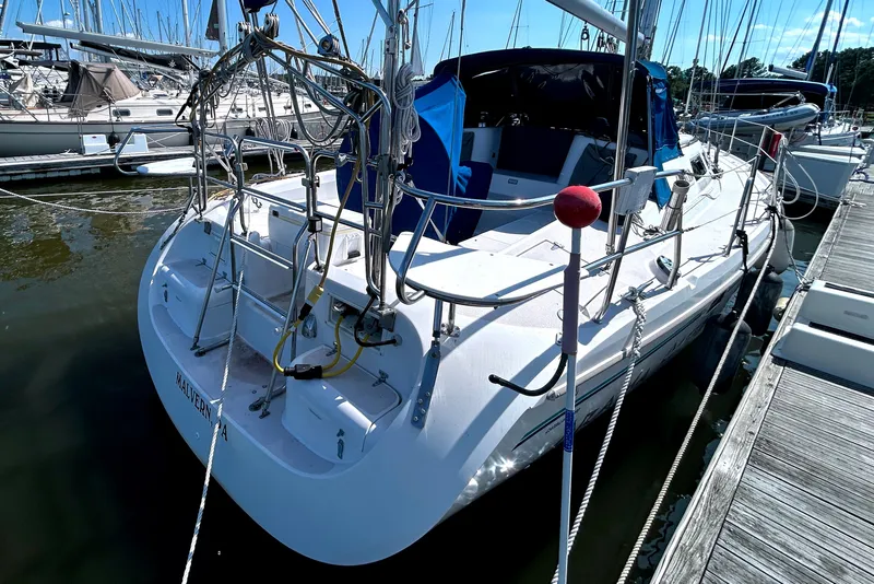 Slide: The Image of Sailboat Catalina 380, 1997 model, docked at marina under clear blue sky. - 15
