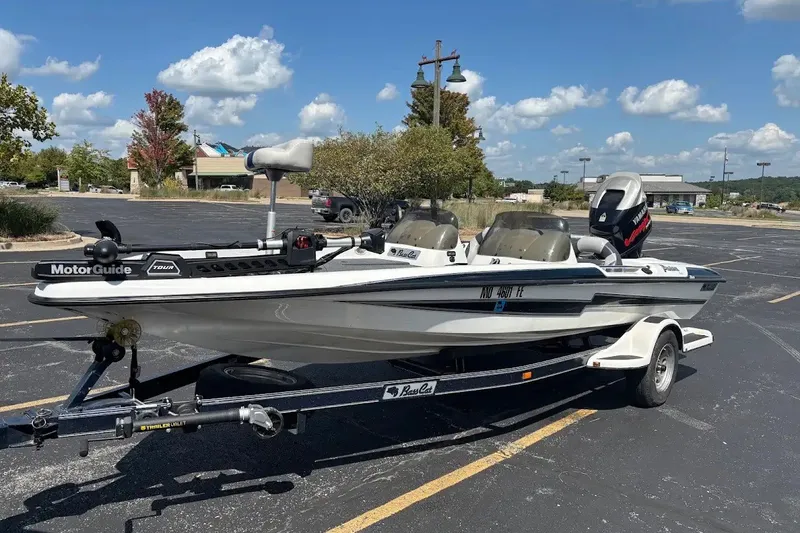 The Image of 2004 Bass Cat Pantera Classic boat on trailer in parking lot. - 0