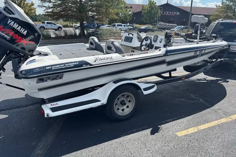 Slide: The Image of 2004 Bass Cat Pantera Classic boat on trailer with Yamaha engine in parking lot. - 3