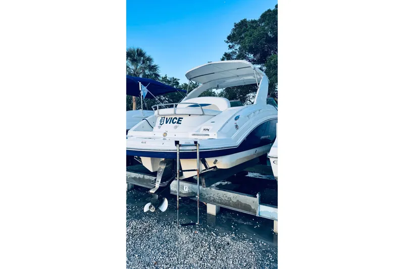 Slide: The Image of 2007 Chaparral 276 SSX boat on trailer, rear view with ladder, outdoors. - 1