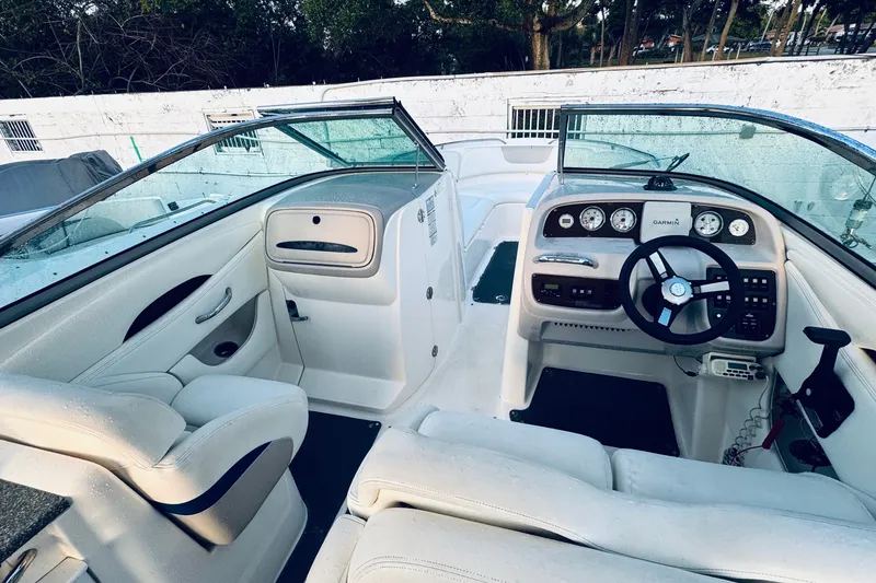 Slide: The Image of 2007 Chaparral 276 SSX boat interior with steering wheel and dashboard controls. - 3