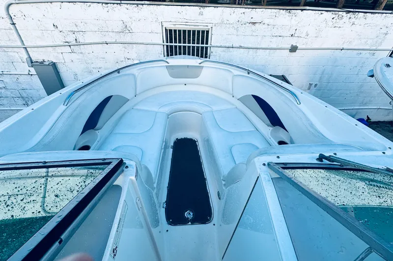 Slide: The Image of 2007 Chaparral 276 SSX boat interior with white seating and sleek design. - 8
