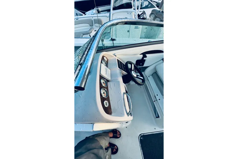 Slide: The Image of 2007 Chaparral 276 SSX boat interior with steering wheel and dashboard controls. - 7