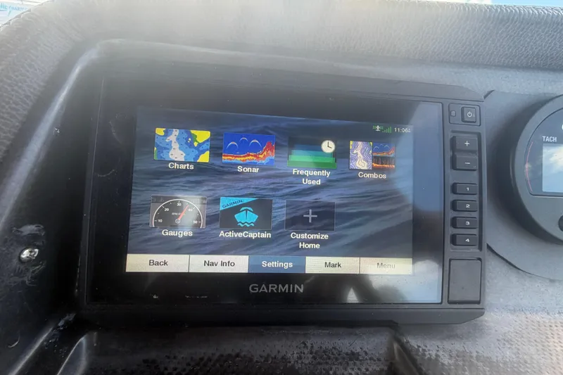 Slide: The Image of Garmin marine display on 2015 Premier 290 Grand View, showing navigation and sonar options. - 65