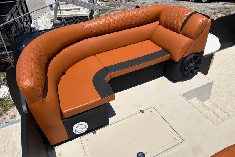 Slide: The Image of Luxurious seating on a 2015 Premier 290 Grand View boat, featuring orange upholstery. - 21