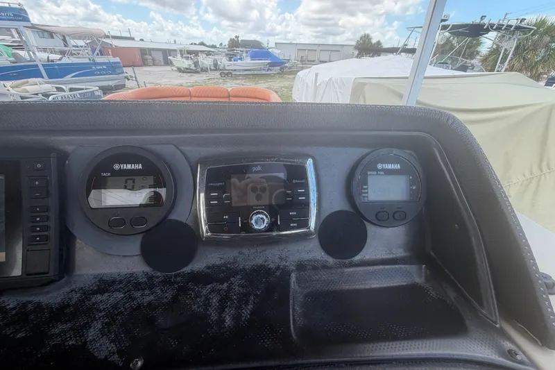 Slide: The Image of Dashboard of 2015 Premier 290 Grand View boat with Yamaha gauges and Polk audio system. - 68