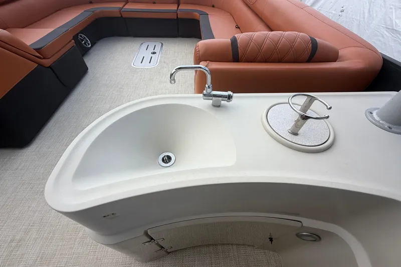 Slide: The Image of Luxurious 2015 Premier 290 Grand View boat interior with sink and plush seating. - 40