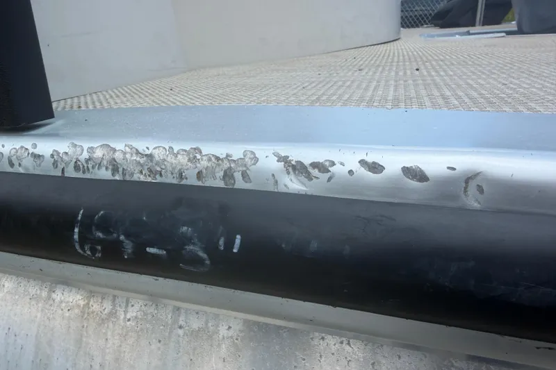 Slide: The Image of Damaged aluminum surface on 2015 Premier 290 Grand View boat. - 18