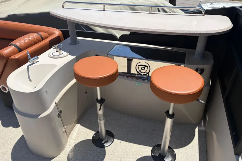 Slide: The Image of Luxury bar area on 2015 Premier 290 Grand View pontoon boat with stools and sink. - 32