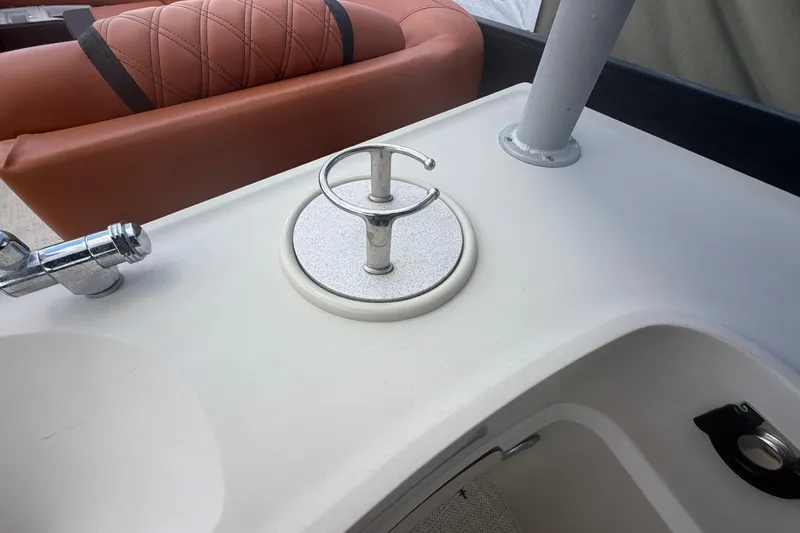 Slide: The Image of Boat interior with a chrome faucet and cup holder on a Premier 290 Grand View, 2015 model. - 55
