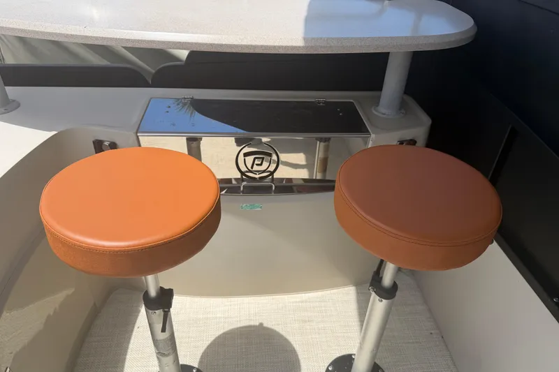 Slide: The Image of Two brown stools on a 2015 Premier 290 Grand View boat. - 79