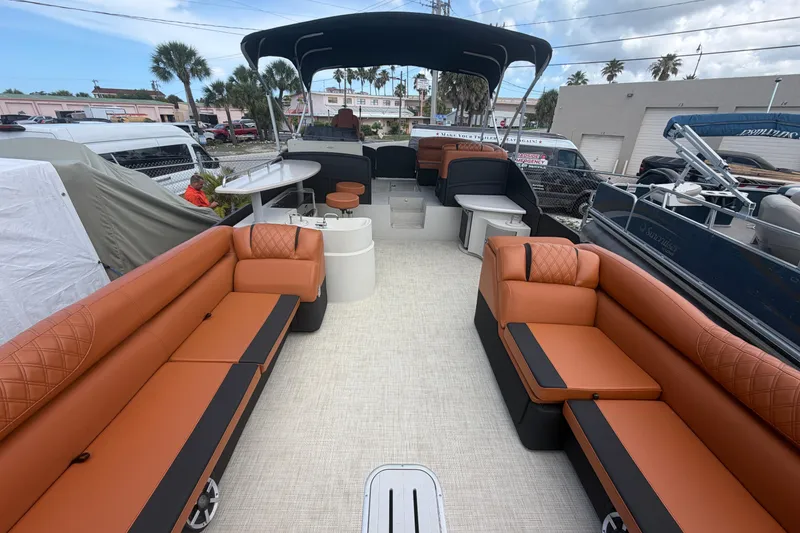 Slide: The Image of Luxurious 2015 Premier 290 Grand View pontoon boat with spacious seating and modern amenities. - 27