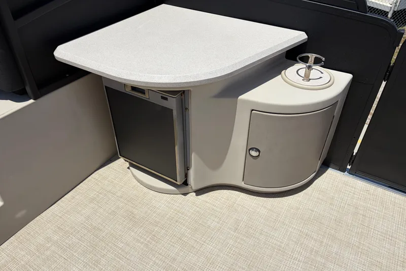 Slide: The Image of 2015 Premier 290 Grand View boat interior with mini fridge and storage cabinet. - 33