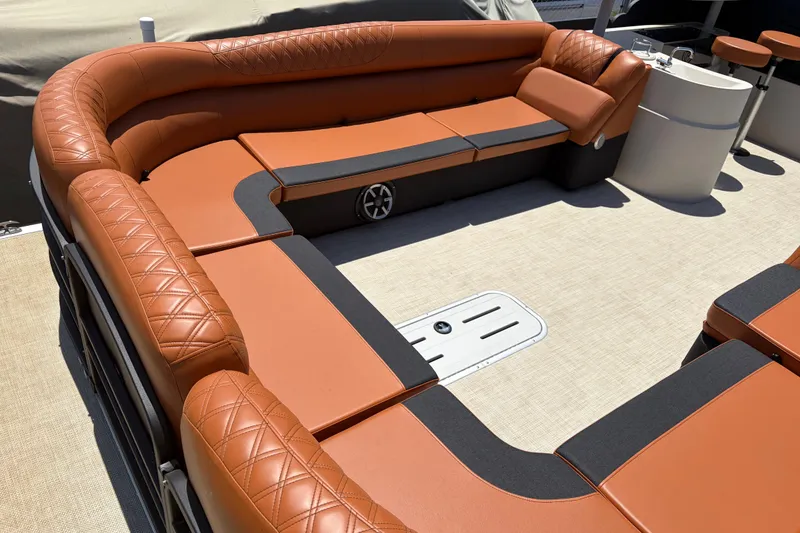 Slide: The Image of Luxurious seating on 2015 Premier 290 Grand View pontoon boat with tan upholstery. - 24
