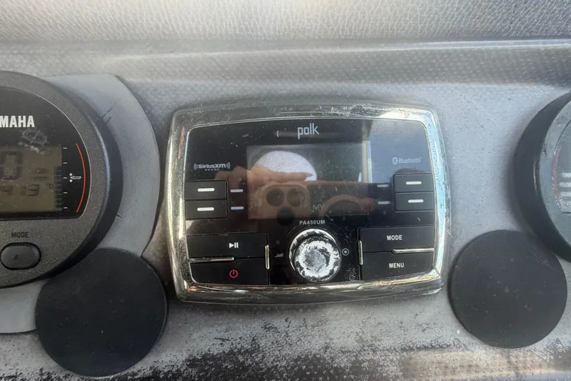 Slide: The Image of Dashboard of a 2015 Premier 290 Grand View with Polk audio system and Yamaha gauge. - 67