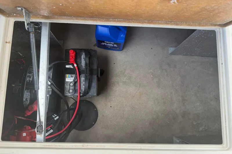 Slide: The Image of Storage compartment of 2015 Premier 290 Grand View with battery and cables. - 82