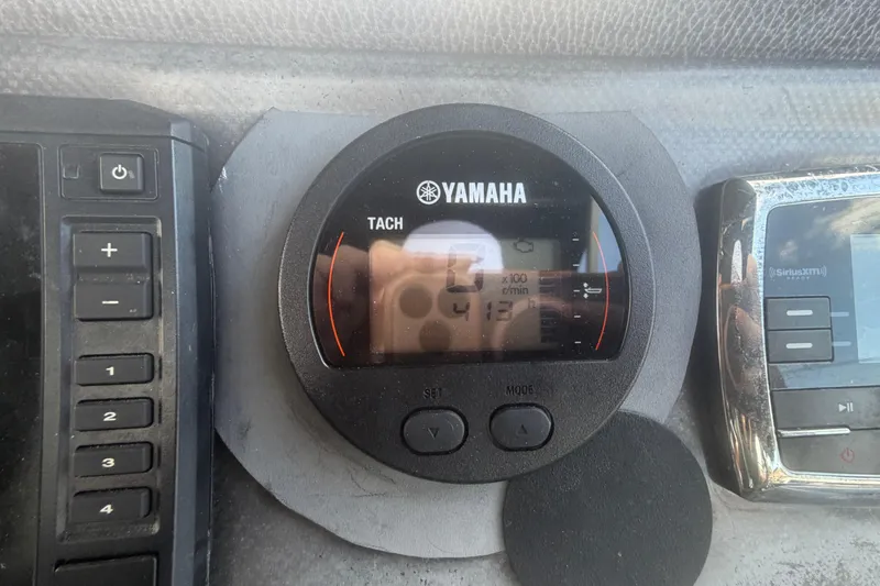 Slide: The Image of Yamaha tachometer on a 2015 Premier 290 Grand View dashboard. - 66