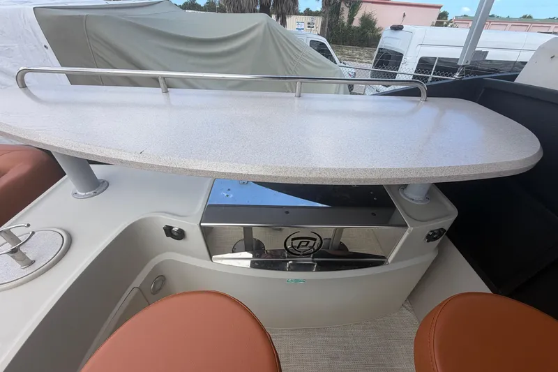 Slide: The Image of 2015 Premier 290 Grand View boat interior with table and seating area. - 60