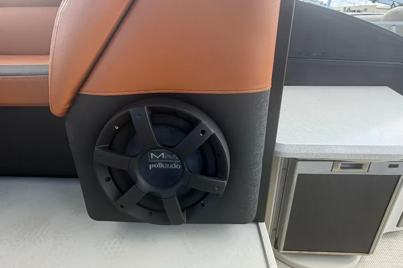 Slide: The Image of Polk Audio speaker on 2015 Premier 290 Grand View boat interior. - 56