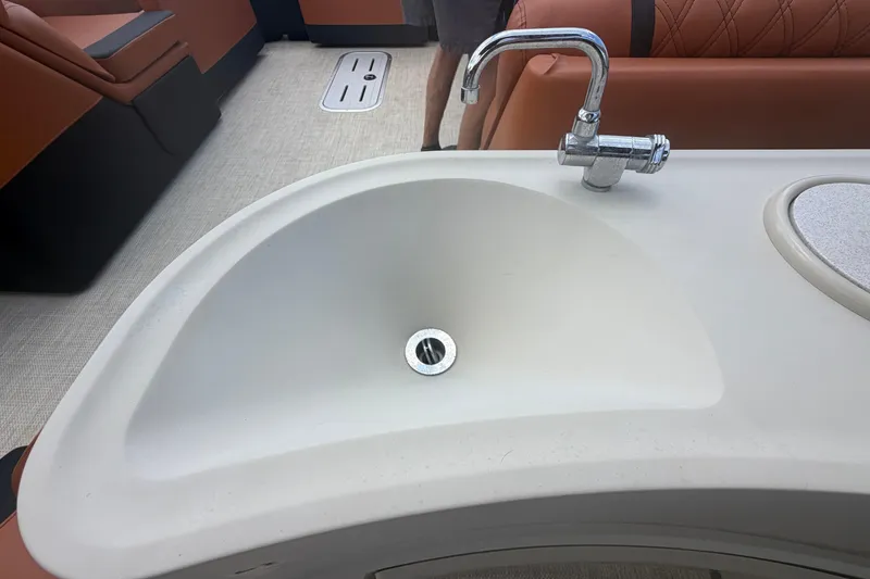 Slide: The Image of Sink and faucet on 2015 Premier 290 Grand View boat with brown seating. - 71