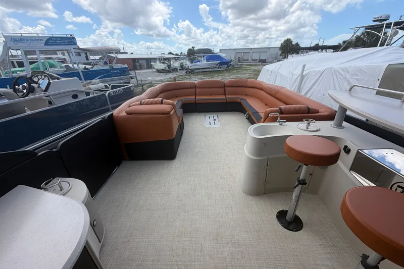 Slide: The Image of 2015 Premier 290 Grand View pontoon boat with spacious seating and modern amenities. - 43