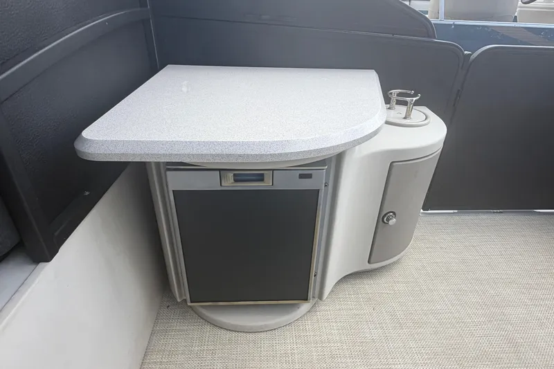 Slide: The Image of 2015 Premier 290 Grand View boat interior with countertop and storage cabinet. - 75